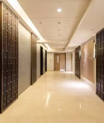 Hotel public corridor with warm ambient lighting
