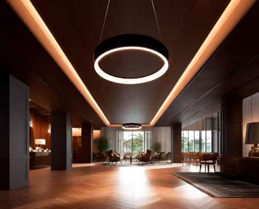 Hotel lobby lounge area with warm lighting and wooden finishes