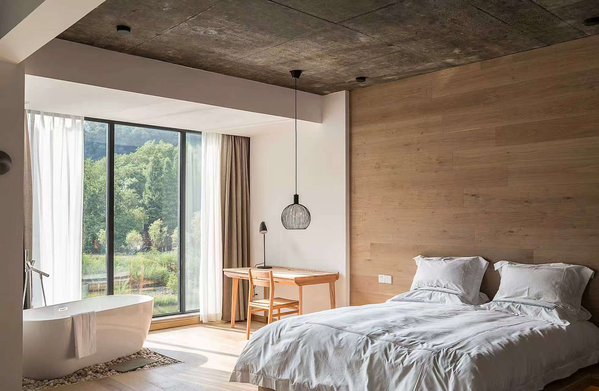 Hotel suite with smart curtains by the window