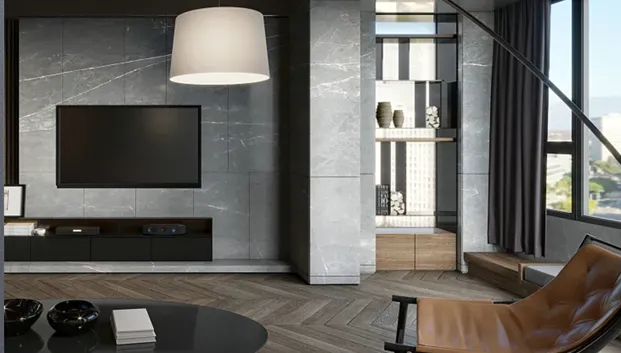 Hotel living area with a wall-mounted TV, marble wall and leather lounge chair